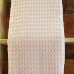 waffle blanket folded, hanging for display